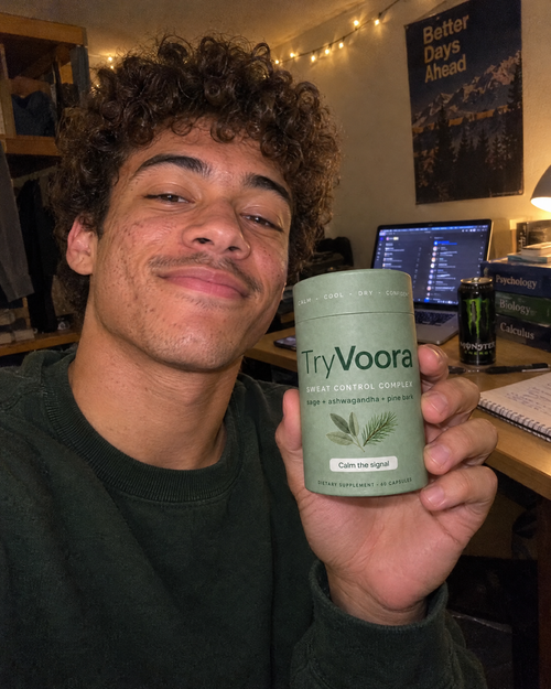 Customer holding Voora at his desk