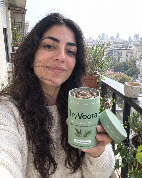 Customer with open Voora canister on her balcony