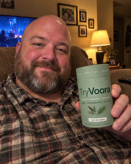 Customer holding Voora on the sofa